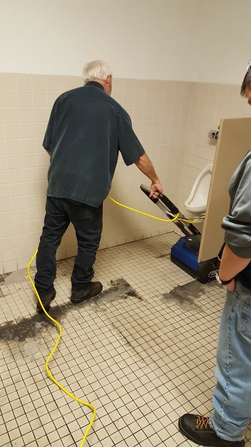 Scrubbing restroom ceramic tile & grout